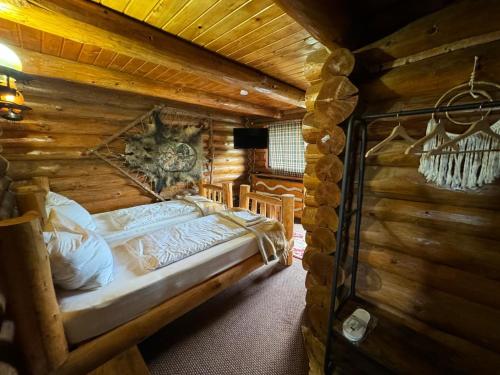 En eller flere senge i et værelse på Vraja Padurii