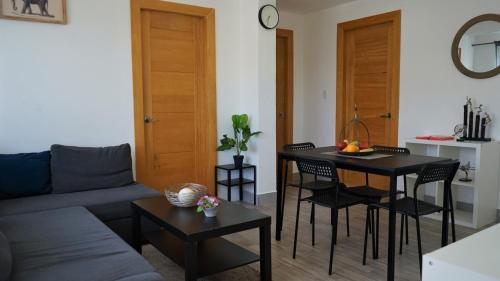 a living room with a couch and a table at La Yarolina in Punta Cana