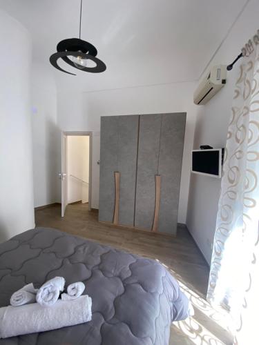 a bedroom with a large bed in a room at Civico10 in Naro