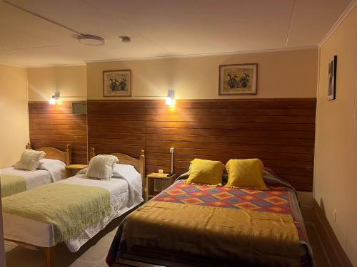 Postel nebo postele na pokoji v ubytování Hostal Maipu Street