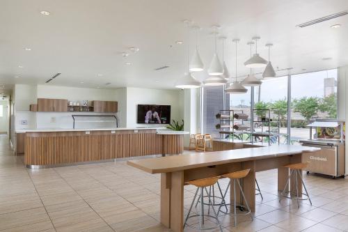 a large kitchen with a large table and chairs at Element Austin Round Rock in Round Rock