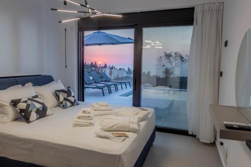 Postel nebo postele na pokoji v ubytování Ventum Villas