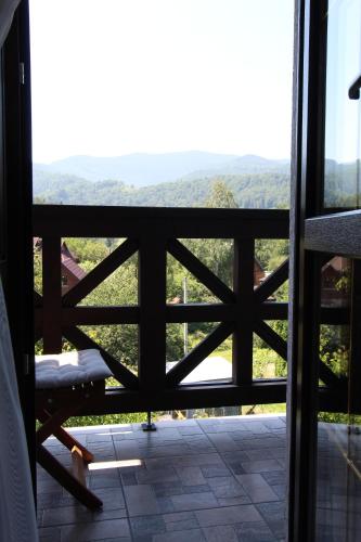 a view from the bedroom window of the mountain view at Бесаги in Yaremche