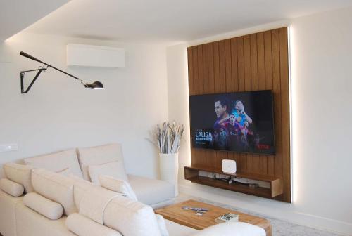 Televisyen dan/atau pusat hiburan di Tu lugar en la playa