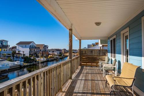 a porch with chairs and a view of the water at ONHC101A Blue Water House in Nags Head