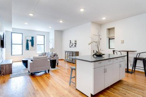 a kitchen and living room with a couch and a table at Goose Island Central Downtown Prime Location with access to patio CHI - 1 in Chicago