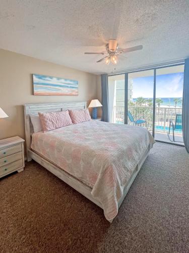a bedroom with a bed and a view of the ocean at Seaside Orange Beach, Gulf Front, Tennis, and Pools! in Orange Beach