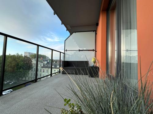 a balcony with a view of a building at Apartamenty Coastal Comfort Kołobrzeg in Kołobrzeg
