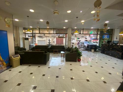 a lobby with couches and chairs in a store at فندق عسل - Asal Hotel in Baghdad