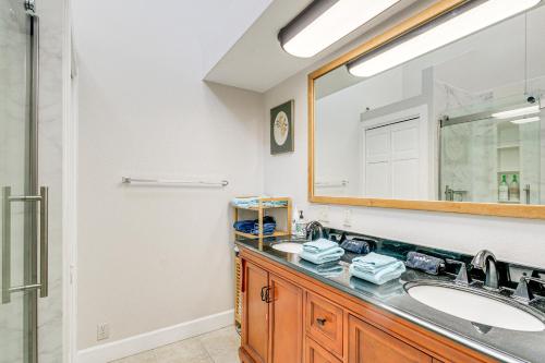 a bathroom with a sink and a mirror at Port Townsend Home Spacious Yard and Mountain Views in Port Townsend