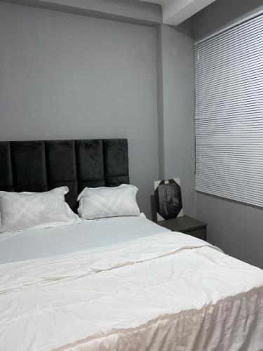 Tempat tidur dalam kamar di EcolinksHouse