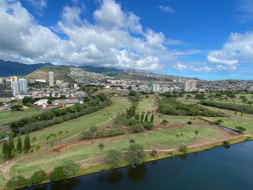 an aerial view of a city next to a river at Amazing View Waikiki Beach 28th Floor 1BR Family and Group Condo in Honolulu