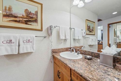 a bathroom with a sink and a mirror at The Charter at Beaver Creek F215 in Beaver Creek