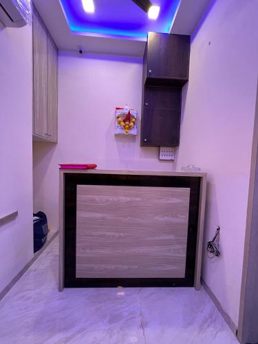 a large flat screen tv sitting in a room at Parel Residency in Mumbai