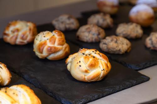 a tray filled with muffins on a table at HCM - Hotel Corais de Manaira in João Pessoa