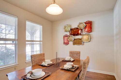 a dining room with a wooden table and chairs at San Antonio Getaway with Deck, Fenced-In Yard! in San Antonio