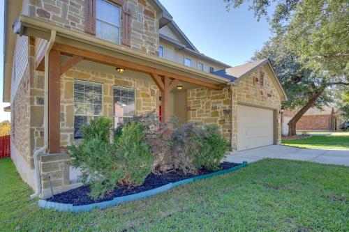 a brick house with a porch and a garage at San Antonio Getaway with Deck, Fenced-In Yard! in San Antonio