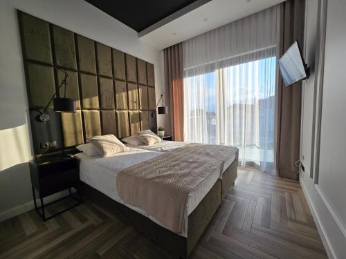 Ένα ή περισσότερα κρεβάτια σε δωμάτιο στο Hevenia apartament 19