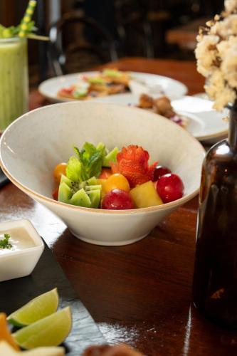 a bowl of fruits and vegetables on a table at Sophia Hotel By OxoHotel in Cartagena de Indias