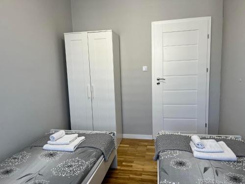 Ένα ή περισσότερα κρεβάτια σε δωμάτιο στο Apartament Next to Old Town