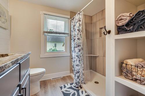 a bathroom with a toilet and a shower at Charming Pepin Home Near Mississippi River! in Pepin