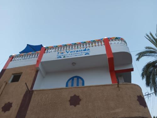 a building with a sign on the side of it at La Veranda 陽台 in Aswan