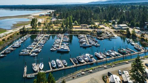 an aerial view of a marina with many boats at Coastal Haven at THE BEACH HOUSE in Campbell River
