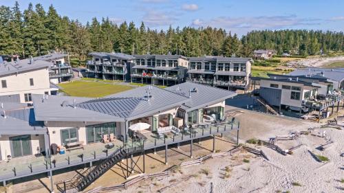 an aerial view of a house on the beach at Coastal Haven at THE BEACH HOUSE in Campbell River