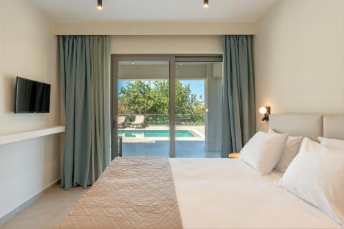 a bedroom with a bed and a swimming pool at Villa Melina - Elysian Villas Kefalonia, 200m from Beach, New 2024 in Minia