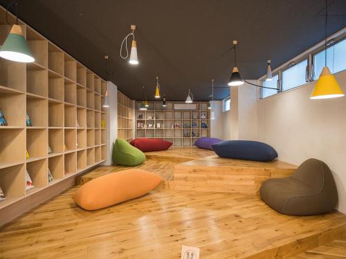 a room with a bunch of colored chairs on the floor at Irifuneso in Ureshino