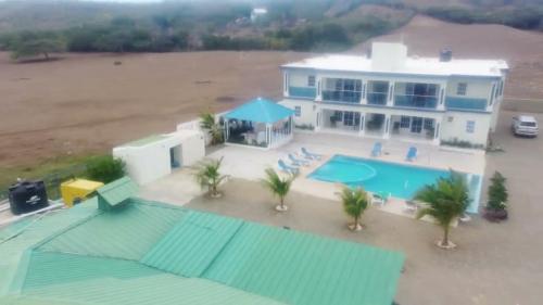 an aerial view of a house with a swimming pool at Punta rucia doña elsa villas in Punta Rucia