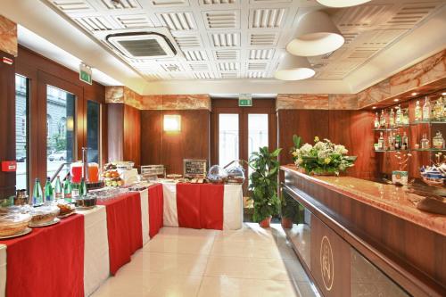 a restaurant with a red and white counter top at Hotel Naples in Naples