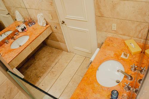 a bathroom with a sink and a toilet in it at Camino Real Zaashila Huatulco in Santa Cruz Huatulco