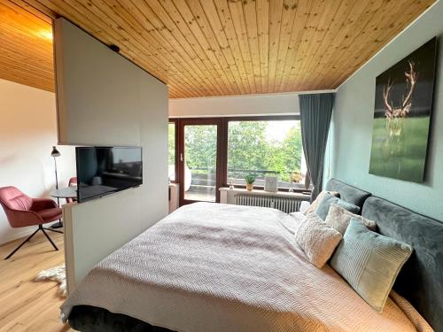 Ένα ή περισσότερα κρεβάτια σε δωμάτιο στο Ferienapartment Buchenberg