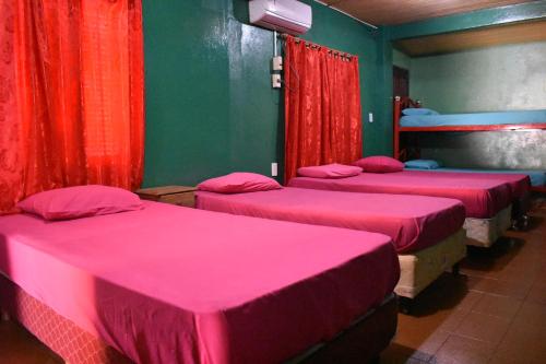 En eller flere senge i et værelse på Casa Roma