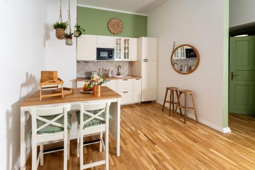 a kitchen with a table and chairs in a room at Apartments with parking space Otocac, Velebit - 20517 in Otočac