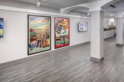 a room with posters on the walls of a building at Holiday Inn & Suites Springfield-I-44 by IHG in Springfield