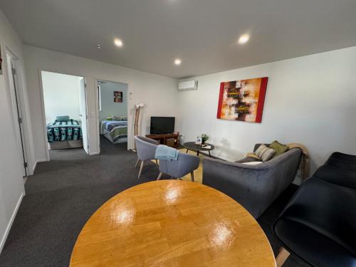 a living room with a couch and a table at 87 on FIFTH Ave in Hamilton
