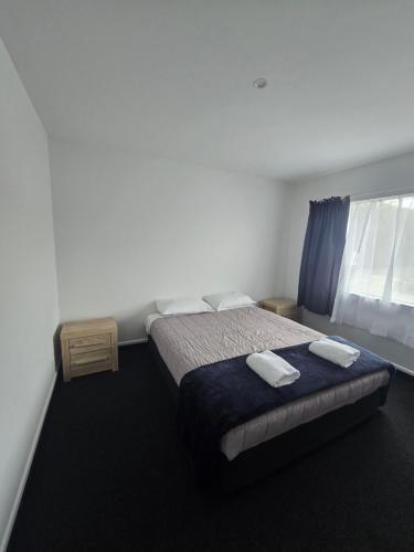 Postel nebo postele na pokoji v ubytování Greenwood Park Motel