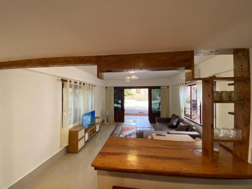 a living room with a couch and a table at Chaloklumbay resort2 in Mae Haad
