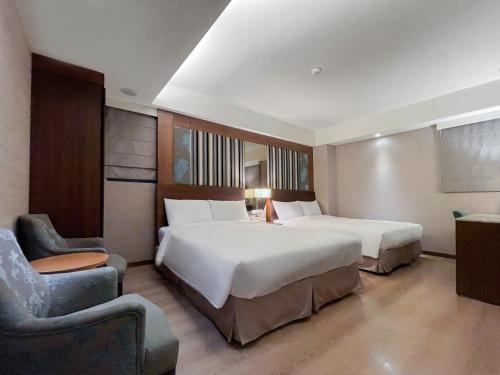 Postel nebo postele na pokoji v ubytování Guide Hotel Taipei NTU