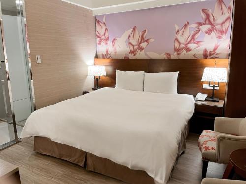 Postel nebo postele na pokoji v ubytování Guide Hotel Taipei NTU