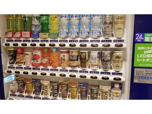 a refrigerator filled with lots of different types of drinks at Sun Royal Utsunomiya - Vacation STAY 02522v in Utsunomiya