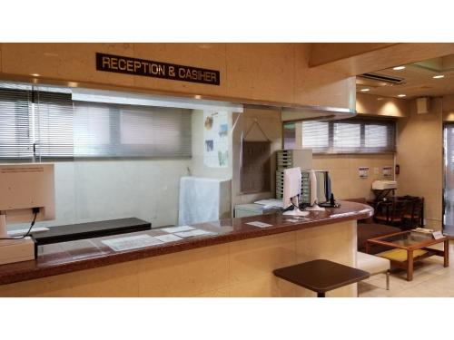 a kitchen with a counter in a restaurant at Sun Royal Utsunomiya - Vacation STAY 02507v in Utsunomiya