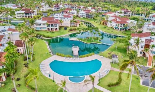 an aerial view of a resort with a swimming pool at Family Villa Oleana Waterviews Oceanfront with water and generator in Vega Alta