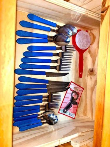 a rack of kitchen utensils hanging on a wall at Alojamiento en cataratas in Puerto Iguazú