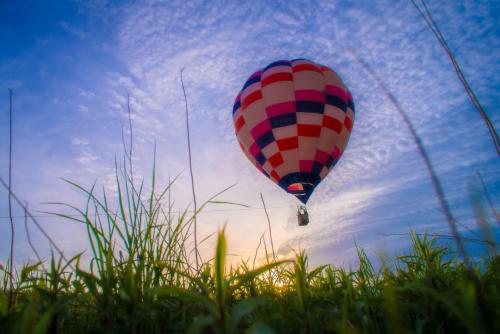 a hot air balloon flying in the sky at SONEKA in Kitahiroshima
