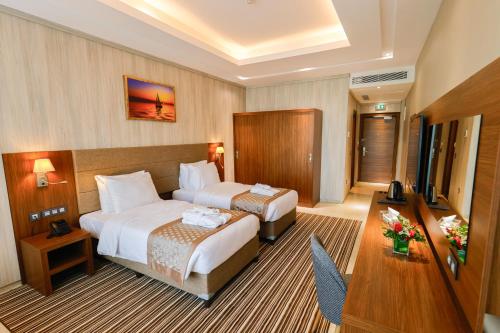 Voodi või voodid majutusasutuse Byblos Hotel toas