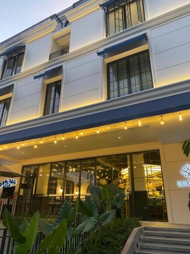 a building with lights on the front of it at Luxeur Jakarta - Setiabudi in Jakarta