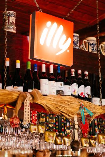 a bunch of bottles of wine on a shelf at PENSIUNEA GAMBRINUS **** in Miercurea-Ciuc